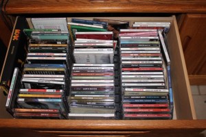 cd's in entertainment stand draw before organizing