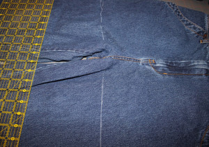 draw chalk line at crotch area of jeans and cut on line 