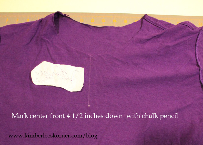 mark t-shirt on wrong side with chalk pencil and draw a line for sewing guide