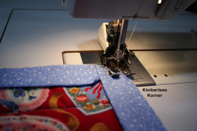 sewing binding onto quilt 