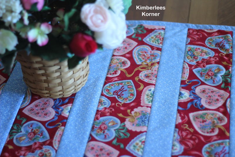 close up of fabric strips on quilt as you go table runner