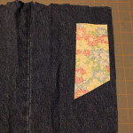 cut tab closure of denim with RS of fabric facing down