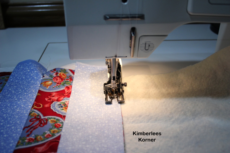 sewing strips with a walking foot to batting and backing of quilt