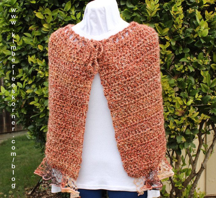 crochet cape with ruffle yarn edging from Kimberlees Korner