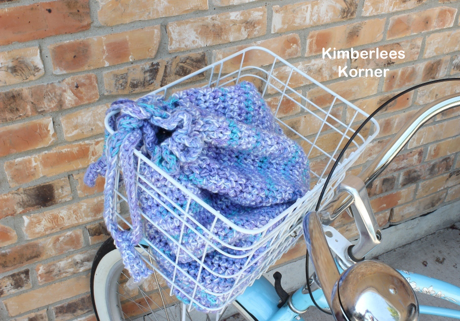crochet market bag in bike basket Kimberlees Korner